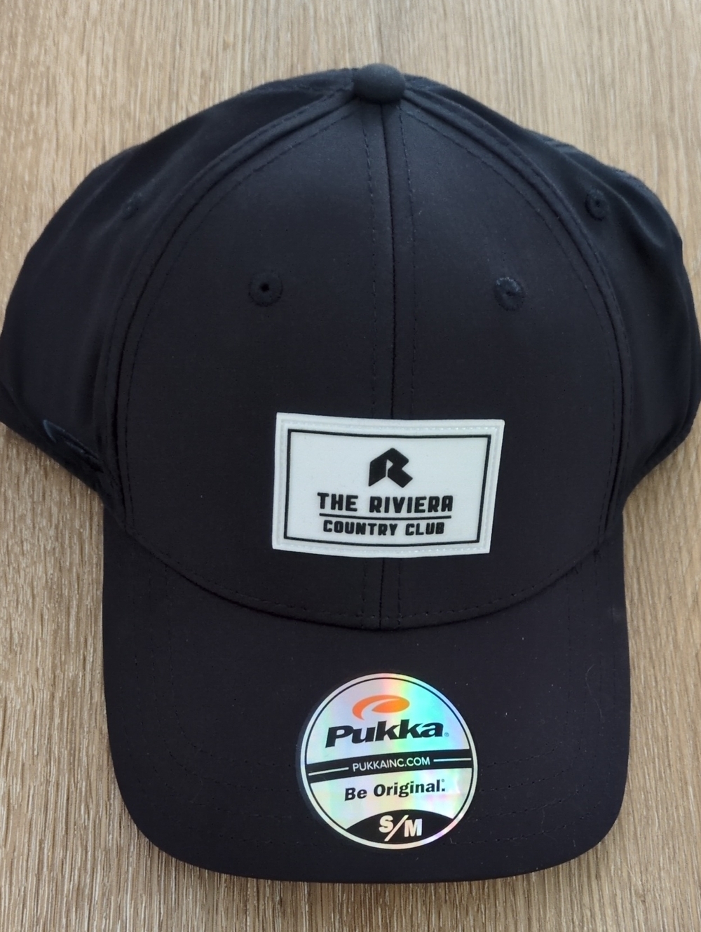 The Riviera Country Club Black Performance Cap by Pukka